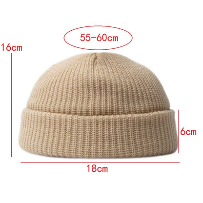 Stay warm with this unisex knitted skull cap beanie hat. Essential cotton blend headwear for winter.
