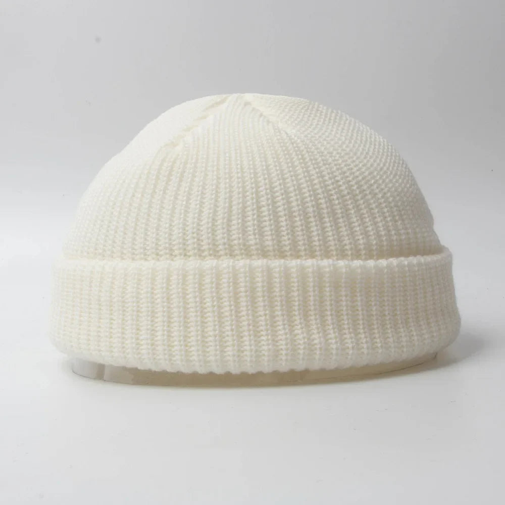 Unisex knitted skull cap beanie hat. Warm winter headwear, comfortable cotton blend accessory.