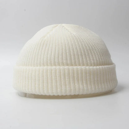 Unisex knitted skull cap beanie hat. Warm winter headwear, comfortable cotton blend accessory.
