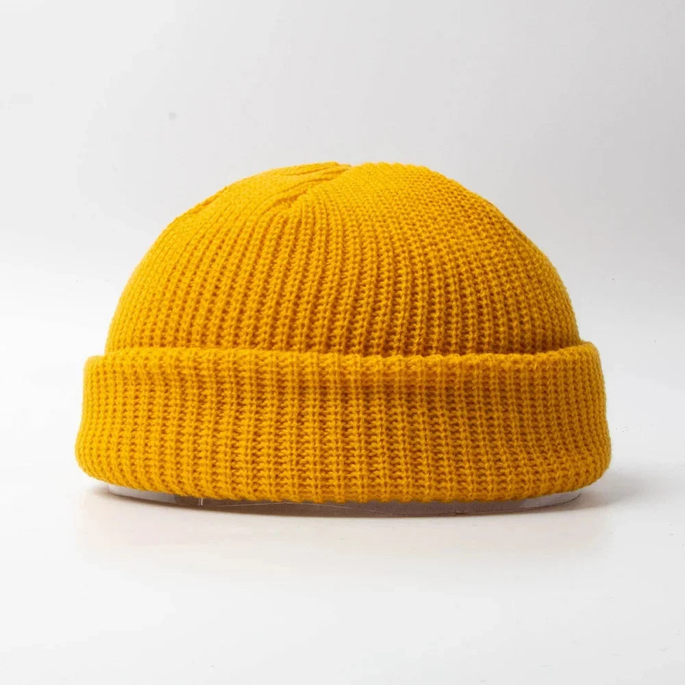 Comfortable unisex knitted skull cap beanie for outdoor activities. Warm cotton blend winter headwear.