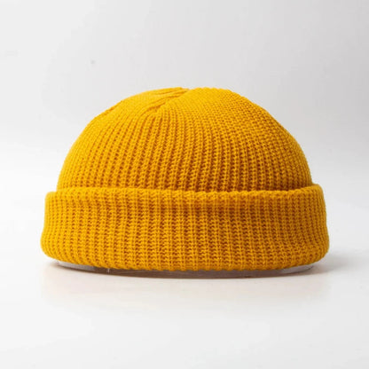 Comfortable unisex knitted skull cap beanie for outdoor activities. Warm cotton blend winter headwear.