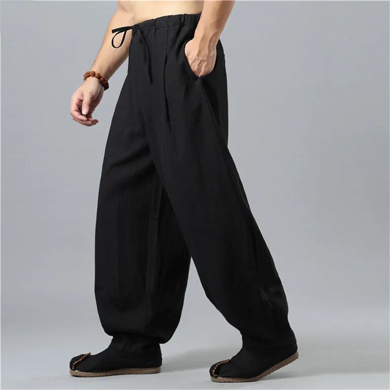 Model wears comfy unisex Kodama baggy pants, ideal for a relaxed fit and trendy casual wear.