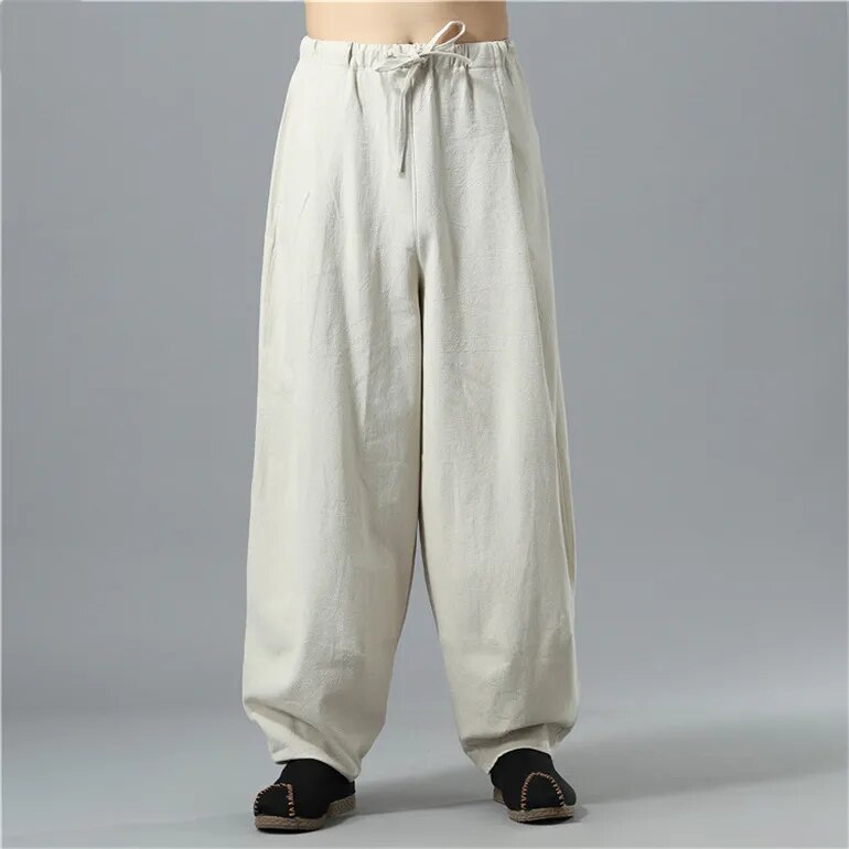 Flat lay of unisex Kodama baggy pants, showcasing relaxed fit, soft material, and versatile everyday fashion.