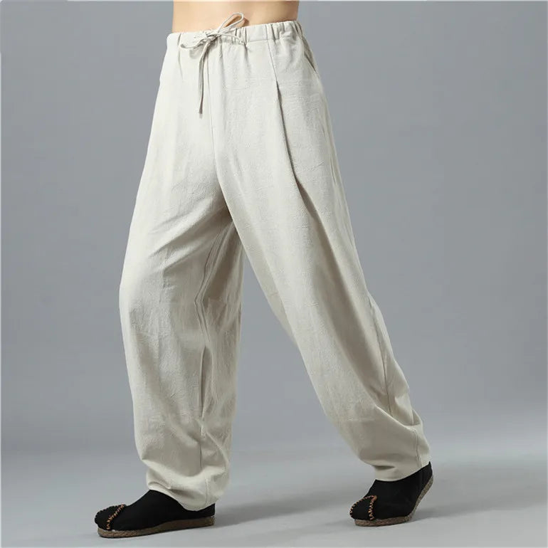 Person lounging in comfortable unisex Kodama baggy pants, perfect for ultimate relaxation and lounge wear.