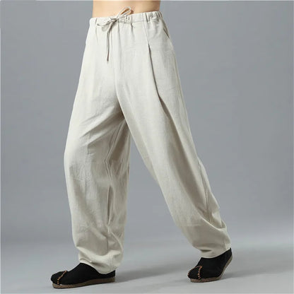 Person lounging in comfortable unisex Kodama baggy pants, perfect for ultimate relaxation and lounge wear.