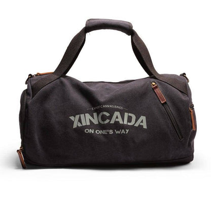 Spacious canvas travel duffel bag, perfect for sports or outdoor gear, featuring a large main compartment and sturdy handles.