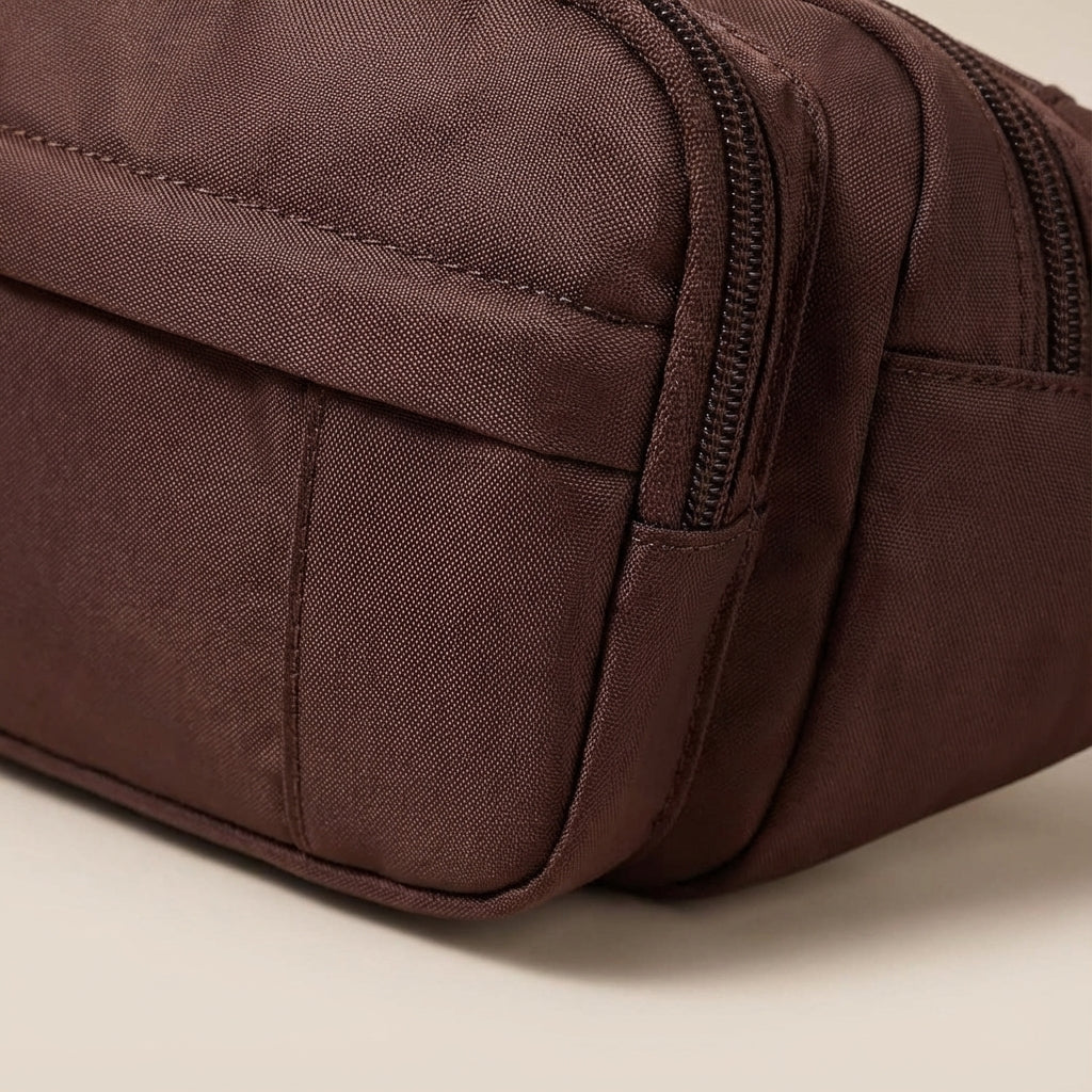Organized storage with a black nylon large capacity fanny pack, perfect for travel & daily essentials.
