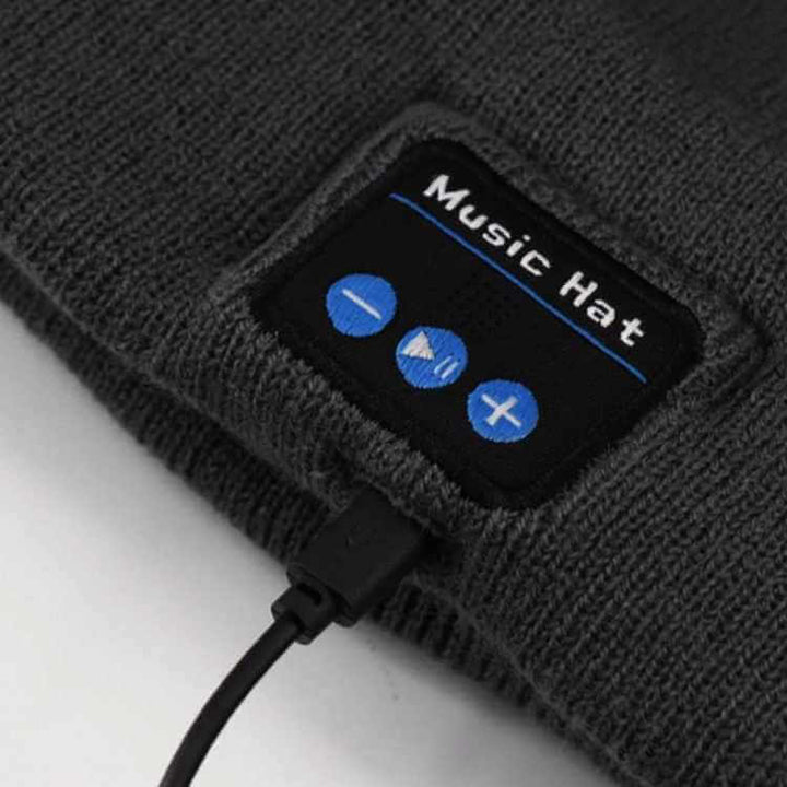 Warm knit unisex Bluetooth beanie with glowing LED panel, ideal for outdoor evening adventures and enhanced safety.