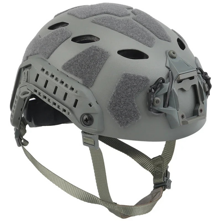 Close-up of a green FAST tactical helmet, showing NVG mount and side rails, ideal protective gear for airsoft.