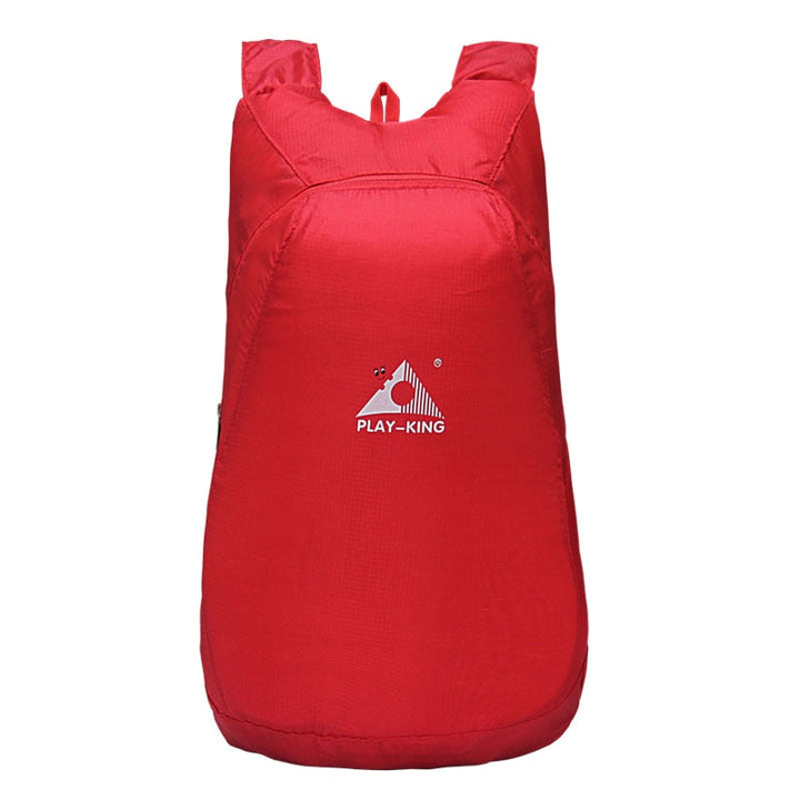 Lightweight water-resistant daypack, 20L capacity, shown folded and packed for easy carry.