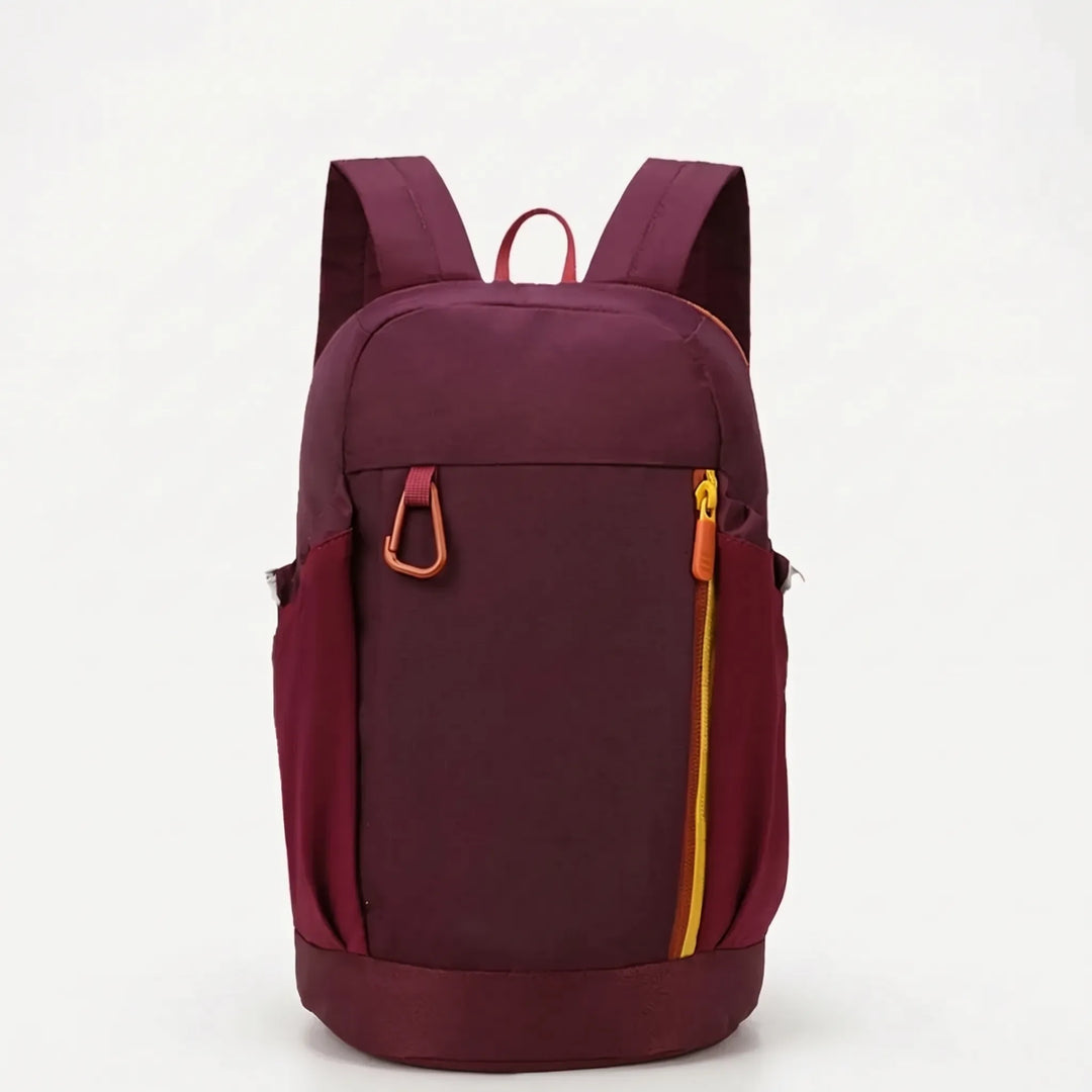 Close-up of side mesh pockets and front zipper on a lightweight travel daypack.