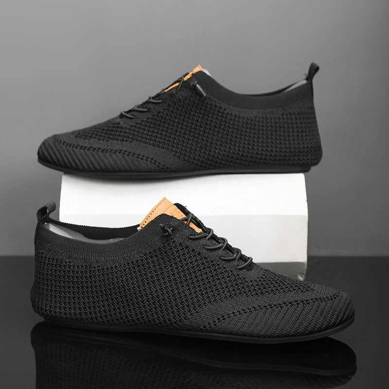Ergonomic lightweight mesh knit slip-on sneakers, providing unisex comfort & support.