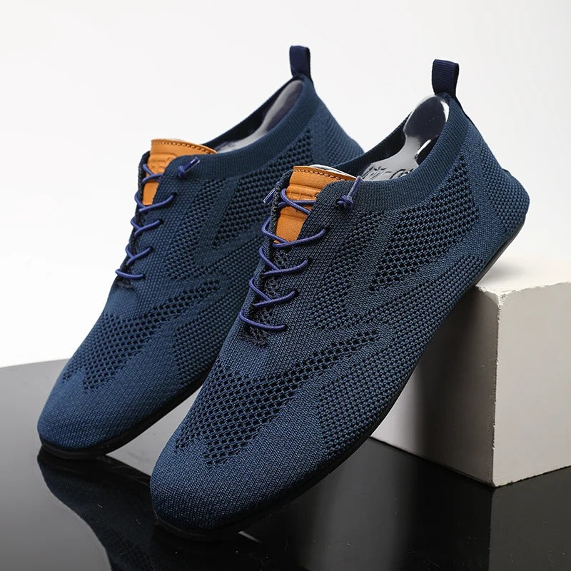 Back view of unisex lightweight mesh knit slip-on sneakers, showcasing easy-wear style.