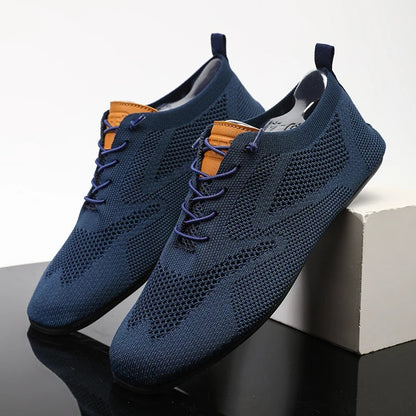 Back view of unisex lightweight mesh knit slip-on sneakers, showcasing easy-wear style.