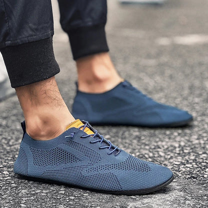 Grey unisex lightweight mesh knit slip-on sneakers, perfect for breathable casual walking.