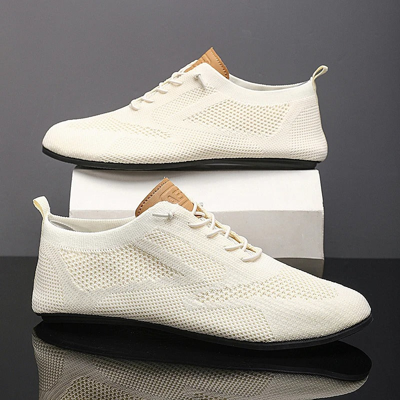 Comfortable slip-on knit sneakers for men and women, lightweight mesh design for breathability.