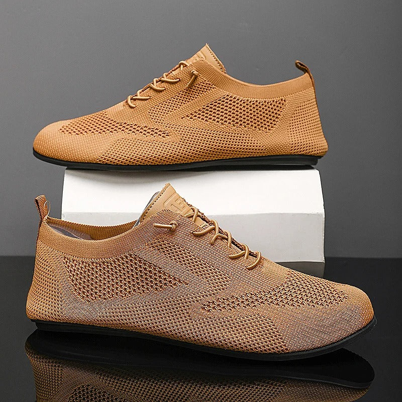 Flexible sole on unisex lightweight mesh knit slip-on sneakers, ensuring walking comfort.