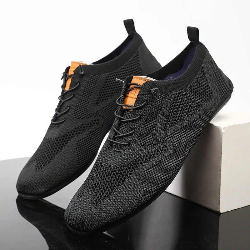 Close-up of knit texture on breathable unisex slip-on sneakers, perfect for walking.