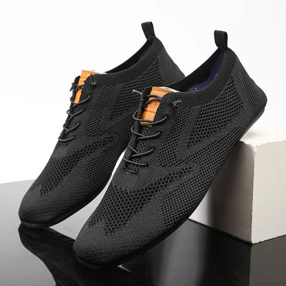Close-up of knit texture on breathable unisex slip-on sneakers, perfect for walking.