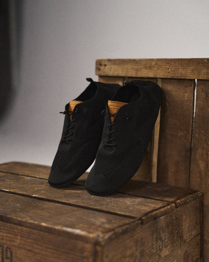 Side view of grey lightweight mesh knit slip-on sneakers, ideal for casual wear & comfort.