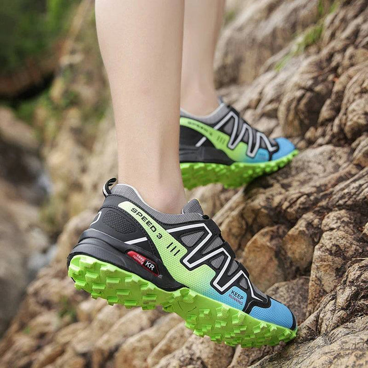 Collection of unisex lightweight non-slip hiking trail shoes in various sizes, indoor shot.