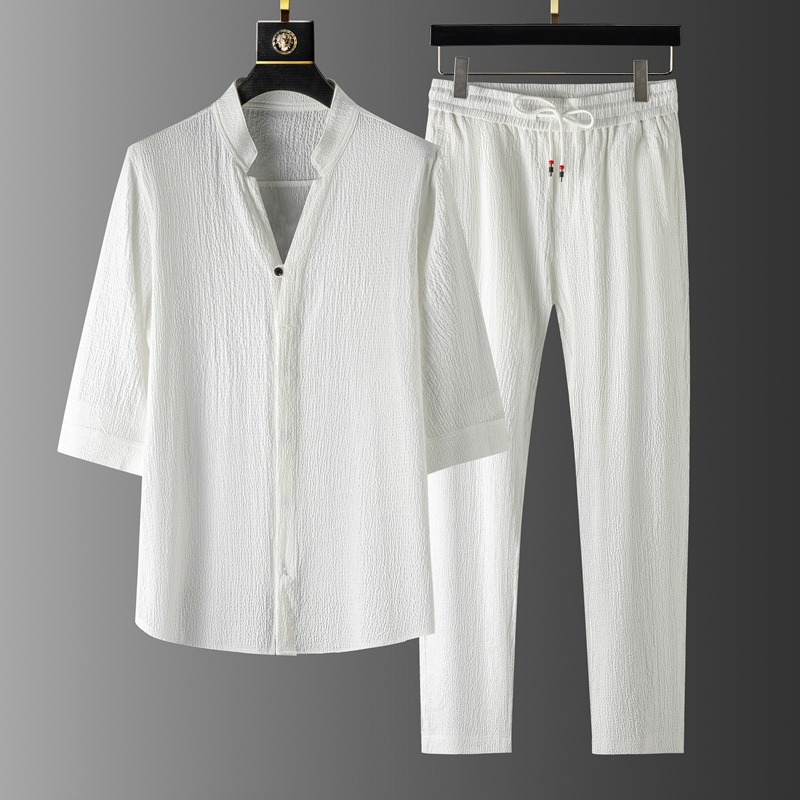 Model enjoying relaxed comfort in a casual unisex linen blend set with drawstring pants, ideal for summer.
