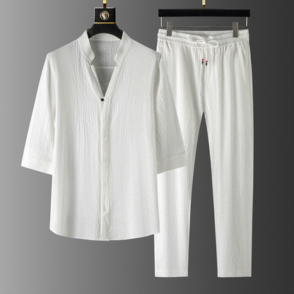 Model enjoying relaxed comfort in a casual unisex linen blend set with drawstring pants, ideal for summer.