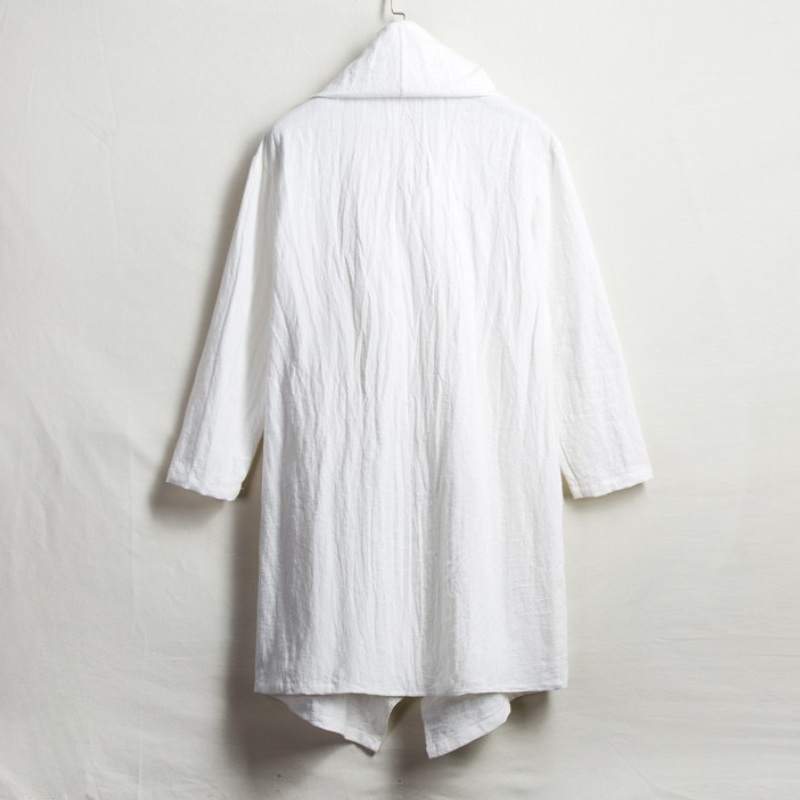 Boho-chic unisex linen cloak with hood. Relaxed fit, versatile for effortless style and comfort.