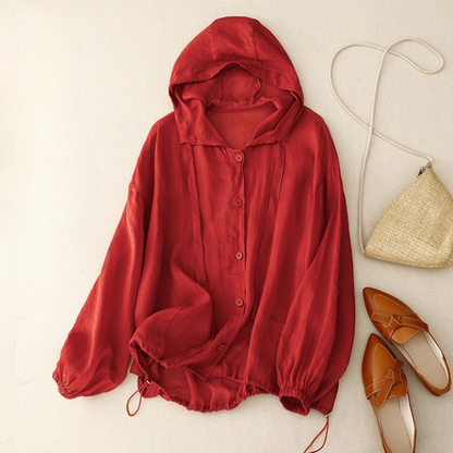 Unisex linen hooded shirt in a light color, perfect for summer beachwear. Lightweight & breathable for casual comfort.