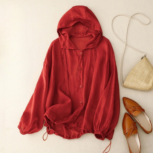 Unisex linen hooded shirt in a light color, perfect for summer beachwear. Lightweight & breathable for casual comfort.