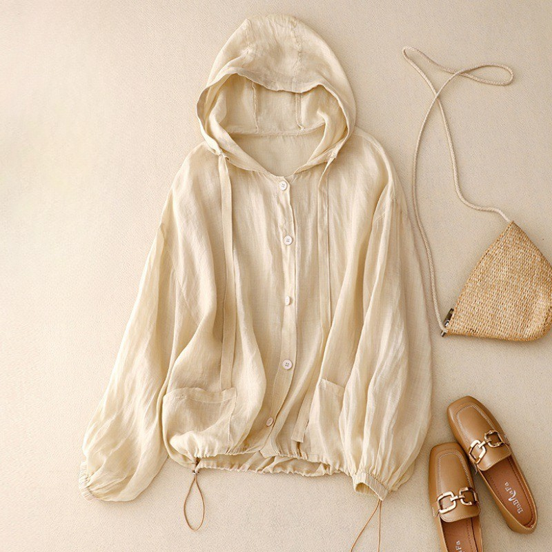 Breathable unisex linen hooded shirt, ideal for summer layering. Features a relaxed fit for casual style and comfort.