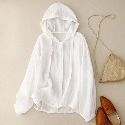 Unisex hooded linen shirt, offering breathable comfort & lightweight feel. Essential summer beachwear for a relaxed look.