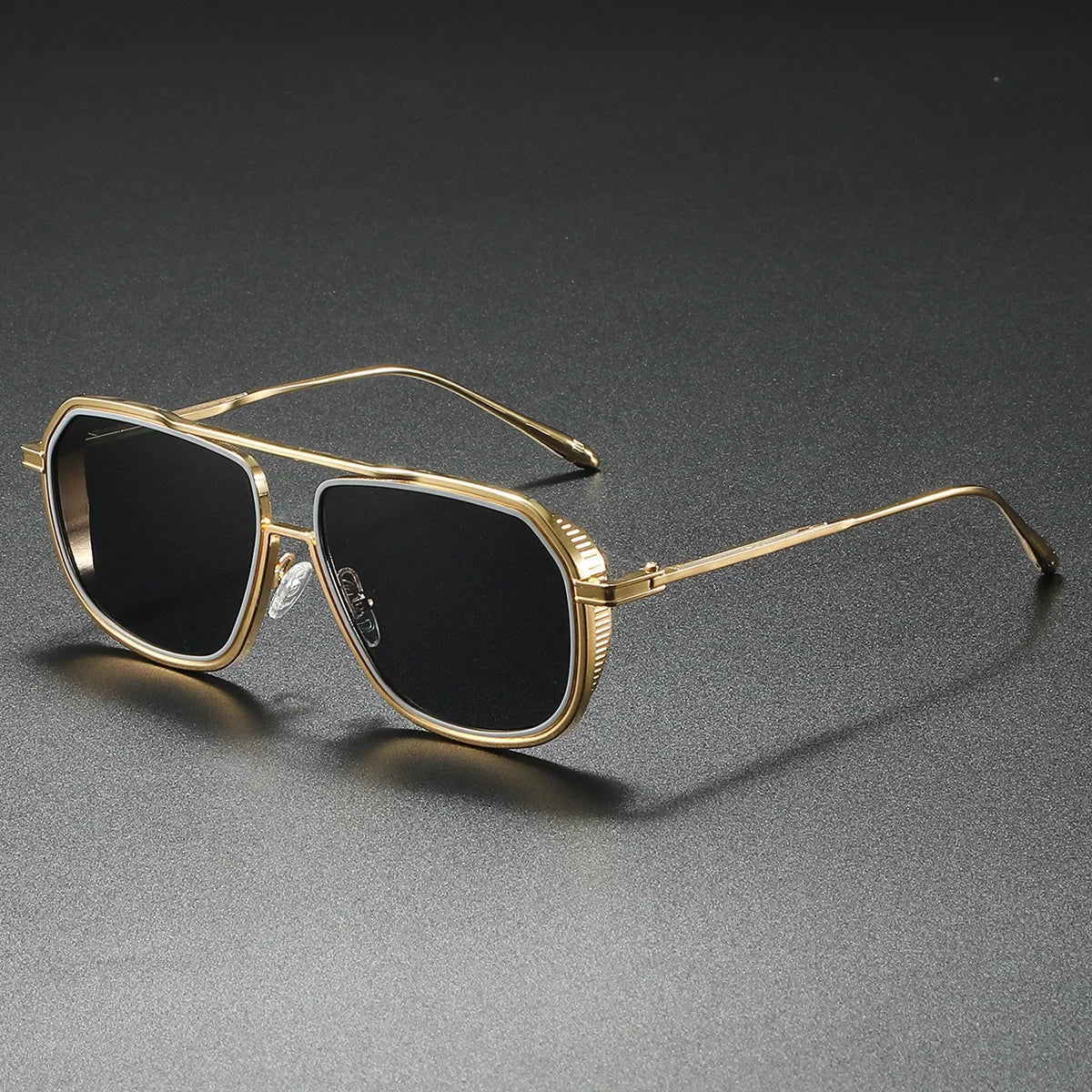 Silver-tone luxury statement sunglasses with UV400 lenses. Essential fashion eyewear for all.