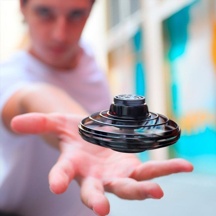 Hovering mini drone helicopter with flashing LED lights, a thrilling flying toy for interactive fun.
