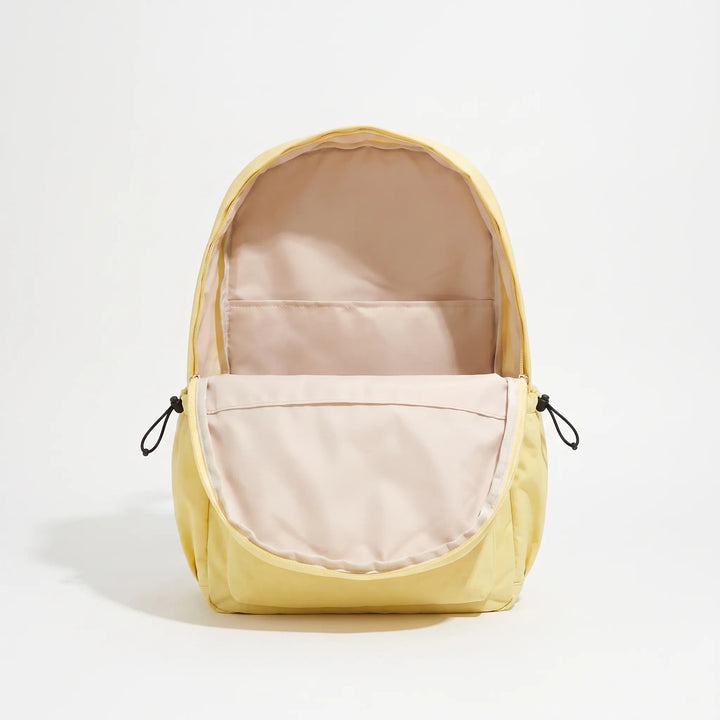 Sleek black nylon minimalist backpack, unisex, ideal for travel, laptop carry, and everyday essentials.