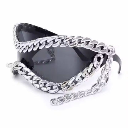Modern unisex sunglasses featuring mirrored silver lenses, black frame, and chic chain accent. Fashion shades.