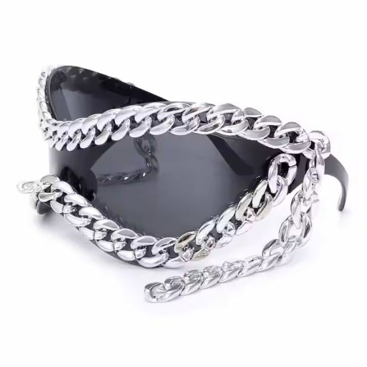 Modern unisex sunglasses featuring mirrored silver lenses, black frame, and chic chain accent. Fashion shades.