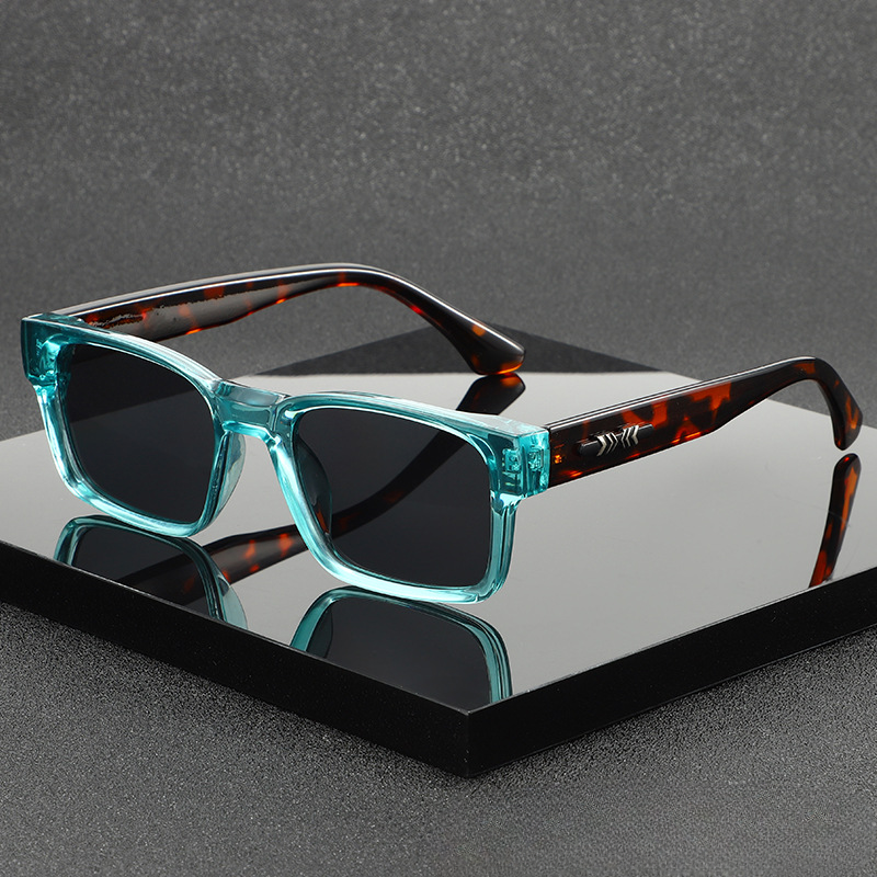 Unisex modern square frame sunglasses with UV400 protection. Fashionable eyewear accessory.