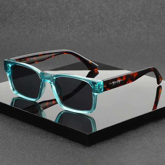 Unisex modern square frame sunglasses with UV400 protection. Fashionable eyewear accessory.