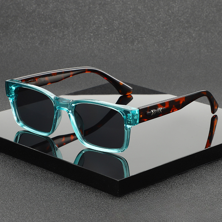 Unisex modern square frame sunglasses with UV400 protection. Fashionable eyewear accessory.