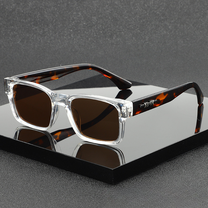Trendy square unisex sunglasses with modern design & UV400 protection. Essential fashion accessory.