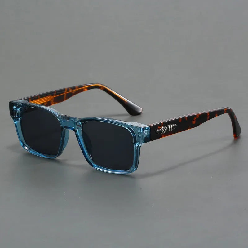 Unisex modern square sunglasses, black frames, UV protection. Stylish eye protection for all.