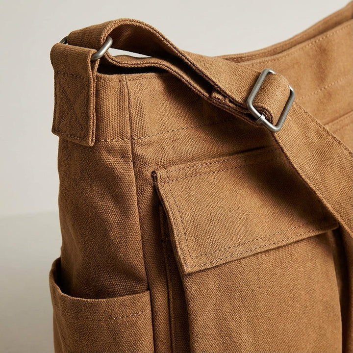 Durable, lightweight canvas unisex organizer bag with multiple pockets. Great for travel & daily use.