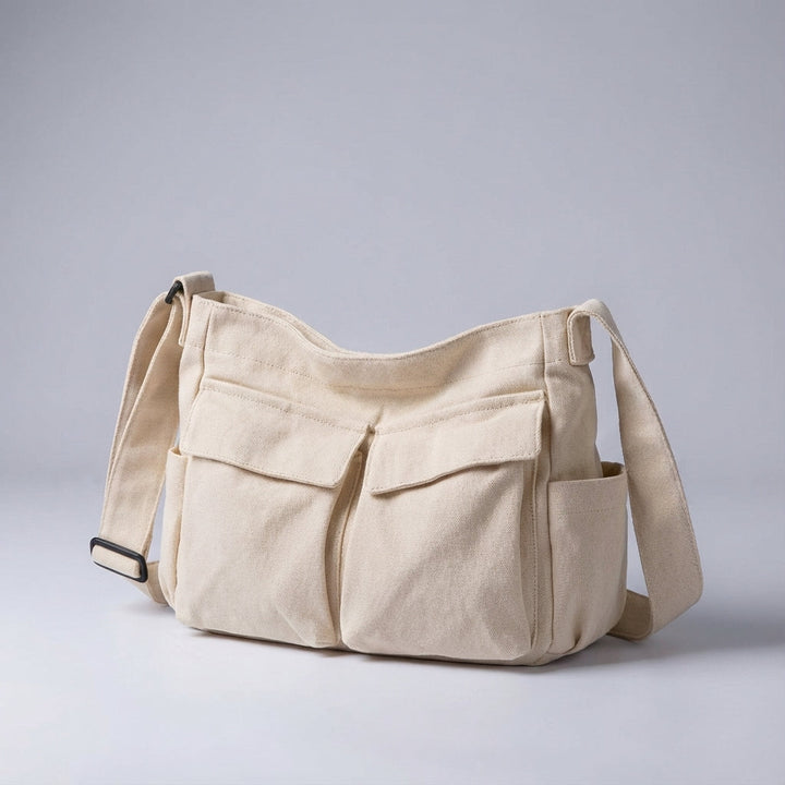 Stylish unisex multi-pocket canvas bag, ideal for everyday carry and travel convenience. Durable design.