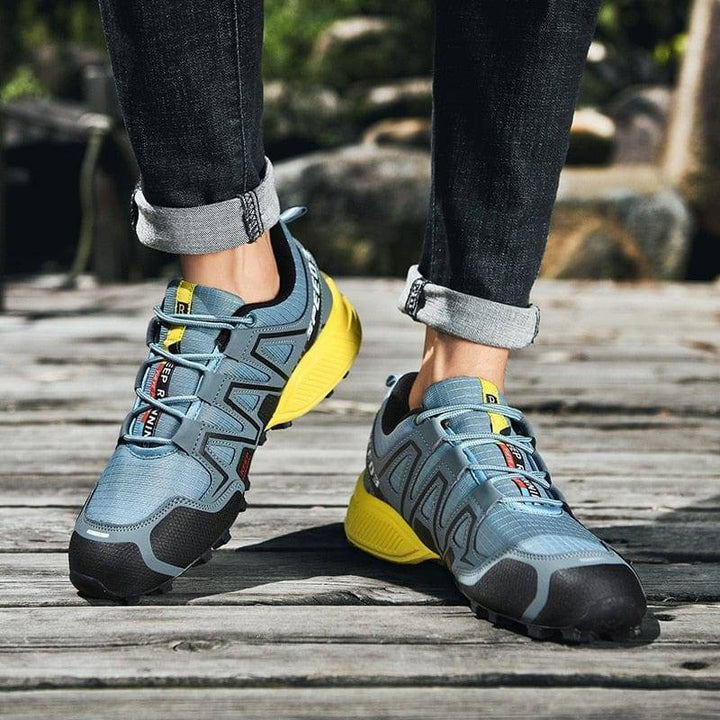 Unisex hiking shoes with robust sole, suitable for challenging trails & cycling activities.
