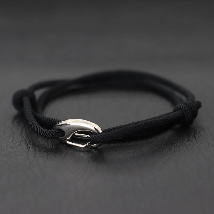 Fashionable unisex rope bracelet with a distinct hook clasp, inspired by nautical themes. Adjustable & waterproof.