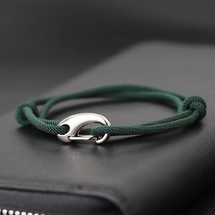 Rugged nautical rope bracelet with a strong hook clasp. Unisex, adjustable, and waterproof for outdoor enthusiasts.