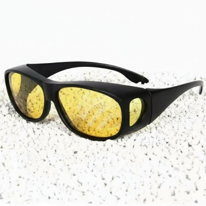 Unisex anti-glare driving glasses designed to fit over prescription eyewear, perfect for night, fog, and rain.