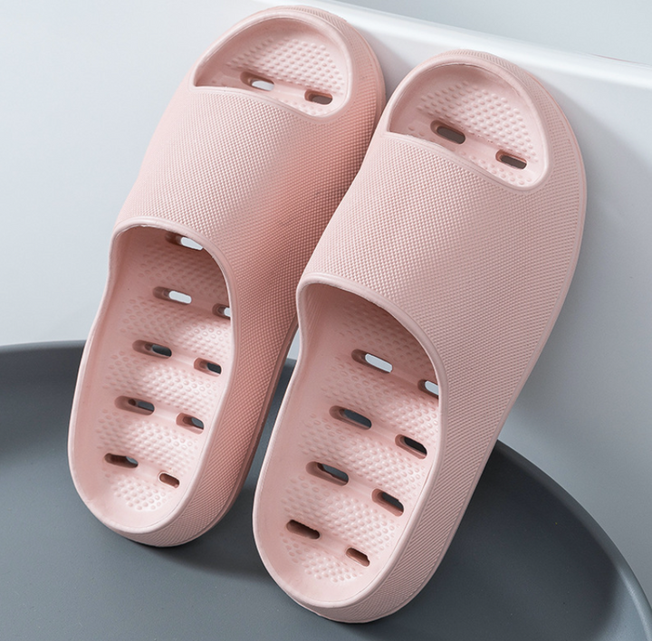 Unisex non-slip bathroom slippers in soft white, designed for ultimate comfort and safety on wet floors.