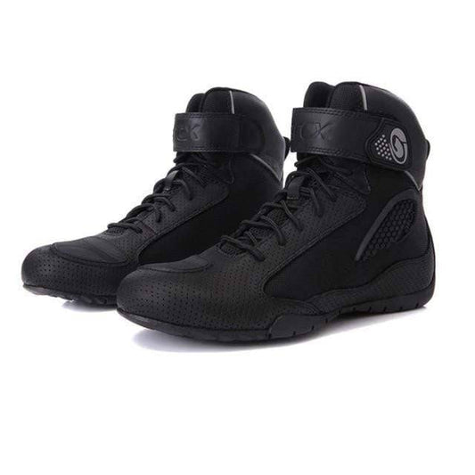 Unisex off-road adventure motorcycle boots, black with protective ankle armor and rugged sole.